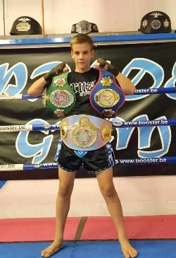 Max Cooper, coach at Pride Gym Sheffield, with his championship belts