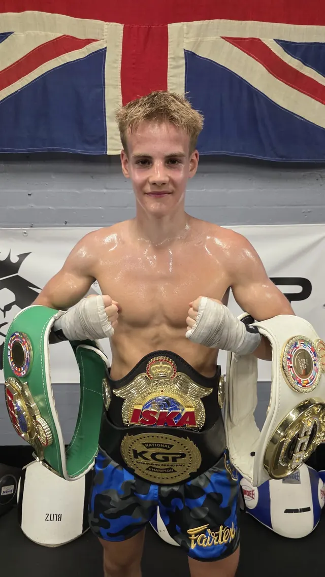 Pride Gym fighter wearing ISKA and KGP kickboxing championship belts
